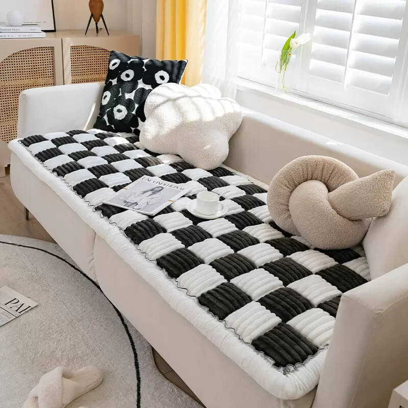 Pet blanket draped over a sofa, blending as home decor while offering pet comfort