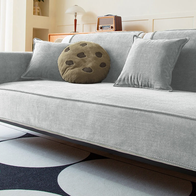 Unisex corduroy sofa protector, anti-slip and durable, designed for pet owners and home aesthetics.