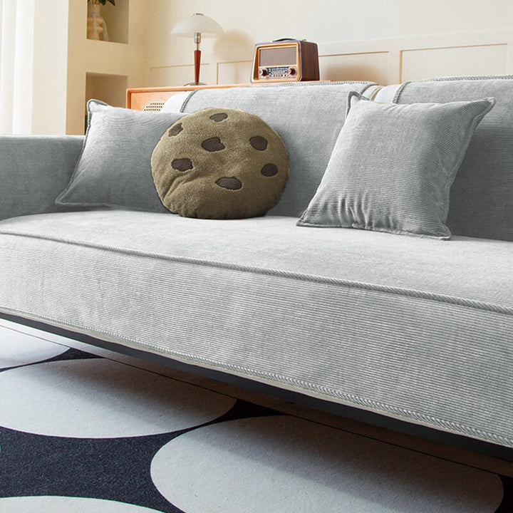 Unisex corduroy sofa protector, anti-slip and durable, designed for pet owners and home aesthetics.