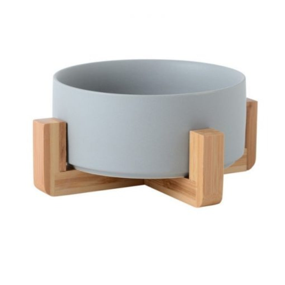 Modern pet accessory: new ceramic dog or cat bowl featuring a natural wooden stand