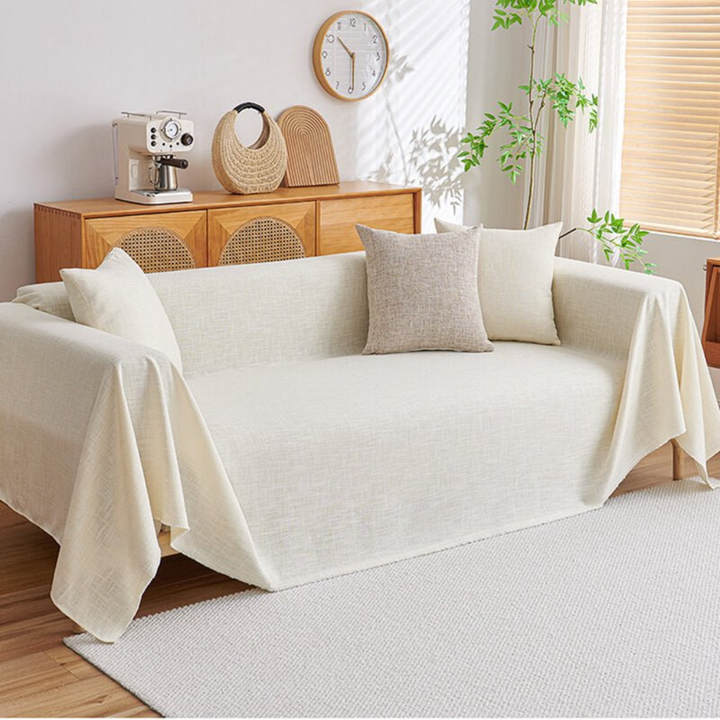 Easy-care cotton linen sectional sofa cover in neutral color, protects living room furniture