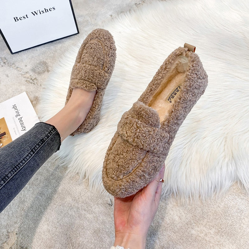 Warm unisex house shoes for fall and winter, featuring a comfortable, soft interior.