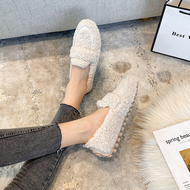 Plush, soft unisex winter slippers offering ultimate warmth and comfort for home wear.