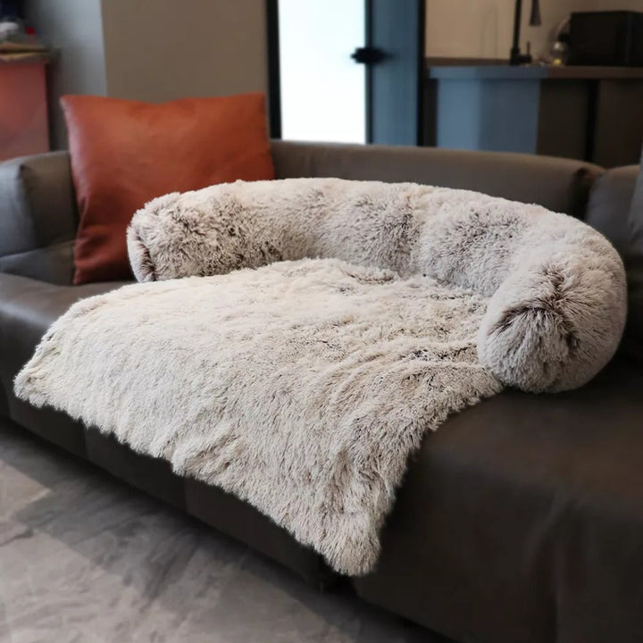 Two pet calming sofa beds, one dark gray and one pink, soft washable anti-anxiety dog beds