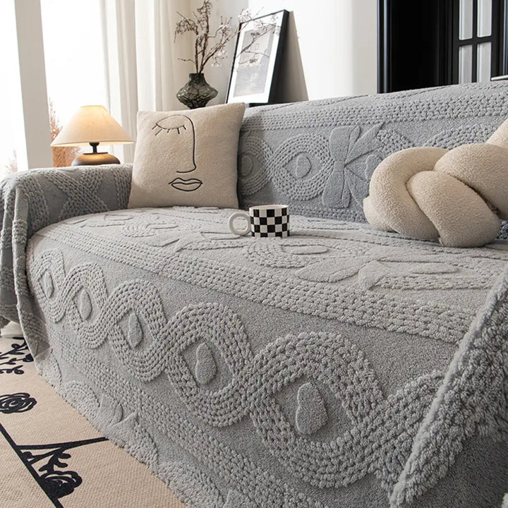 Close-up of jacquard woven sofa throw, demonstrating plush texture and quality