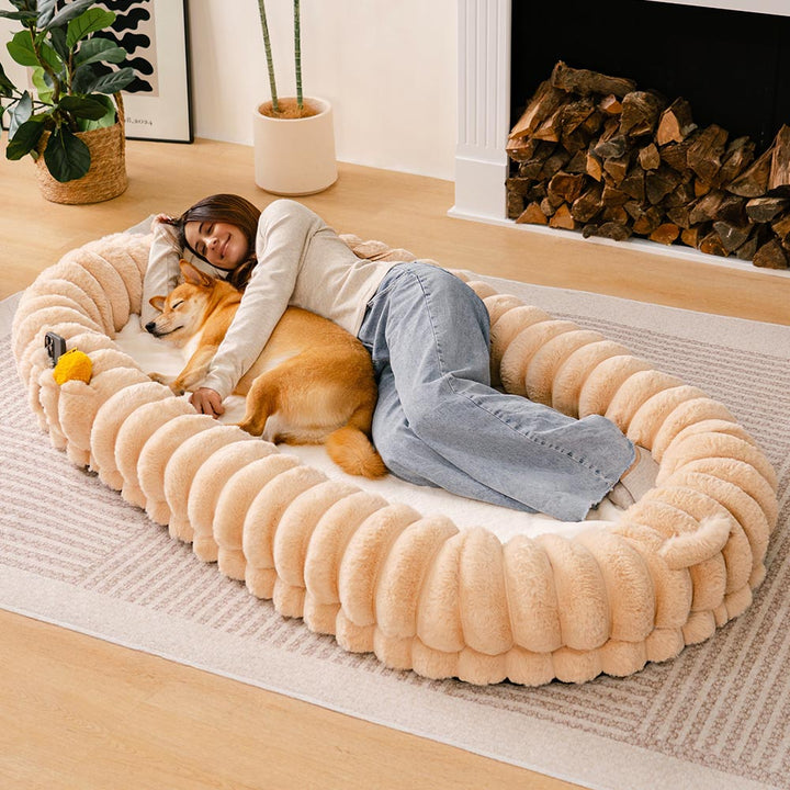 Unisex large orthopedic pet calming cuddle bed, plush donut shape for ultimate pet comfort.