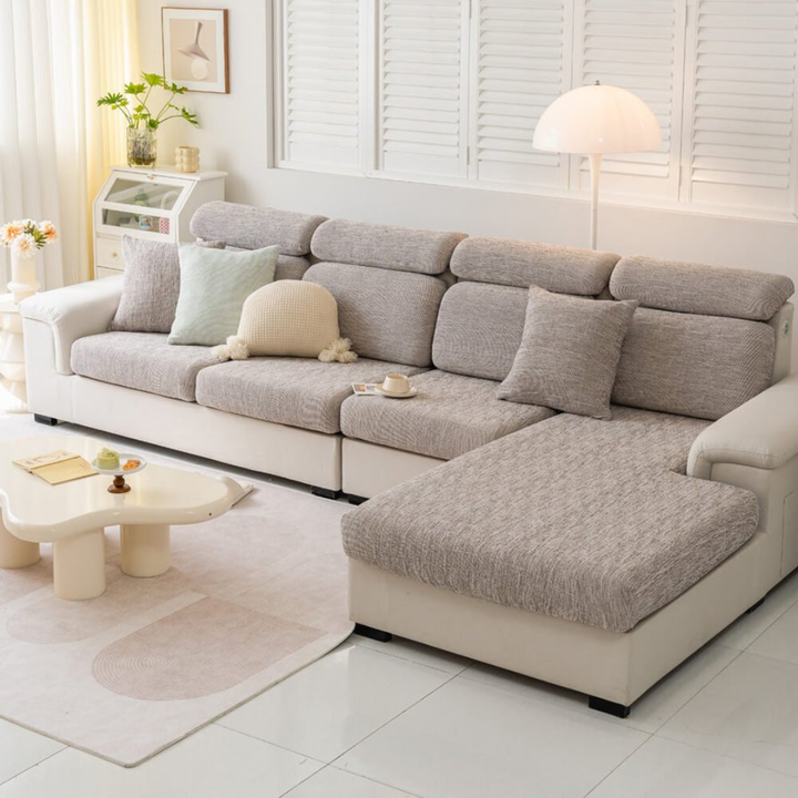 Machine washable linen-blend stretch sofa cover draped over a couch, showing its easy-fit design