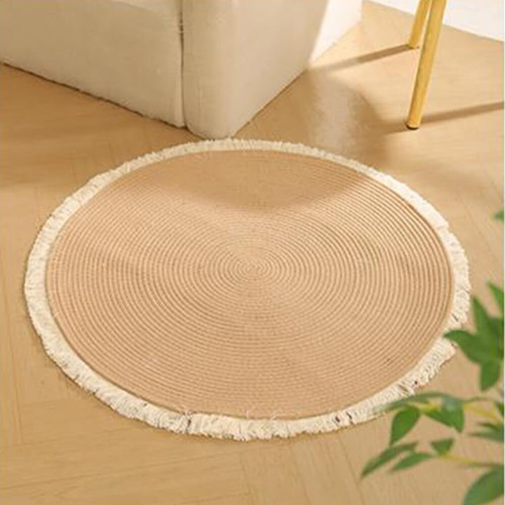 Cat's eye view of a handwoven cotton rope Nordic scratch mat with attractive fringe