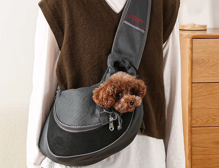 Compact pet carrier shoulder bag for tiny dogs and cats, comfortable and secure for car travel.