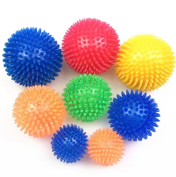 Green chew ball dog toy next to dog biscuits, emphasizing its role in overall pet wellness.