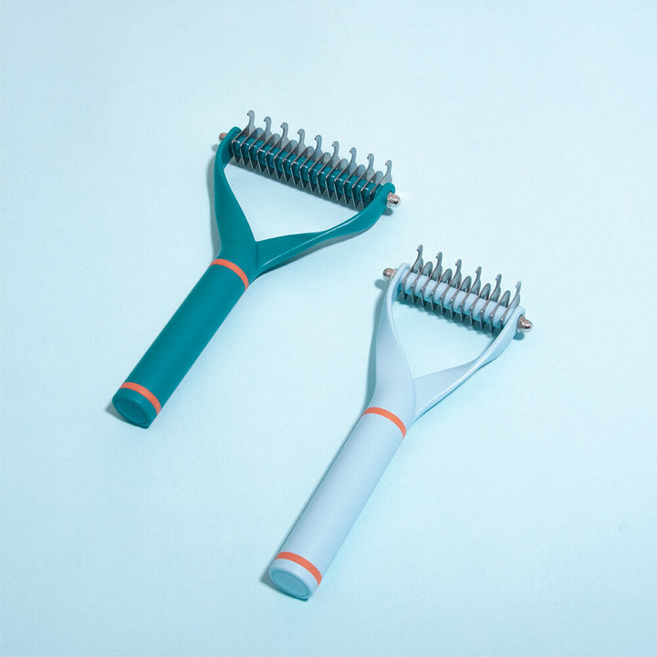 Unisex Pet Dematting Comb for cats and dogs, double-sided with stainless steel blades for effective pet hair removal.