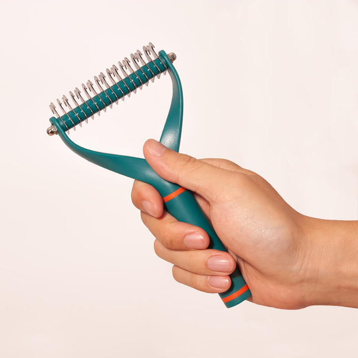 Unisex Pet Dematting Comb in its packaging, indicating a professional-grade grooming tool for pets.