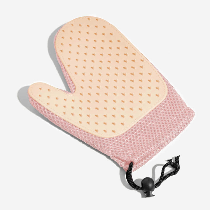 Pet grooming massage glove, an ergonomic pet supply for gentle deshedding.
