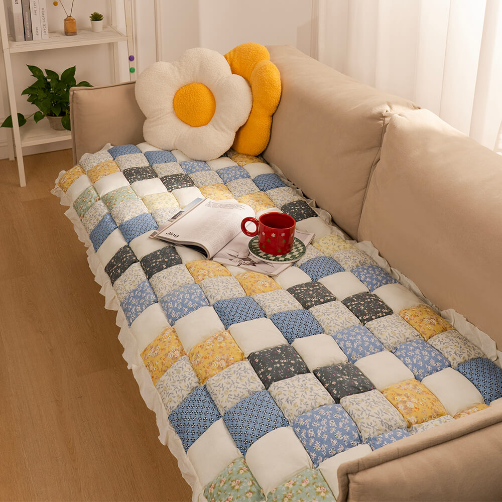 Plaid couch cover with pets relaxing, showcasing comfort and protection, home decor