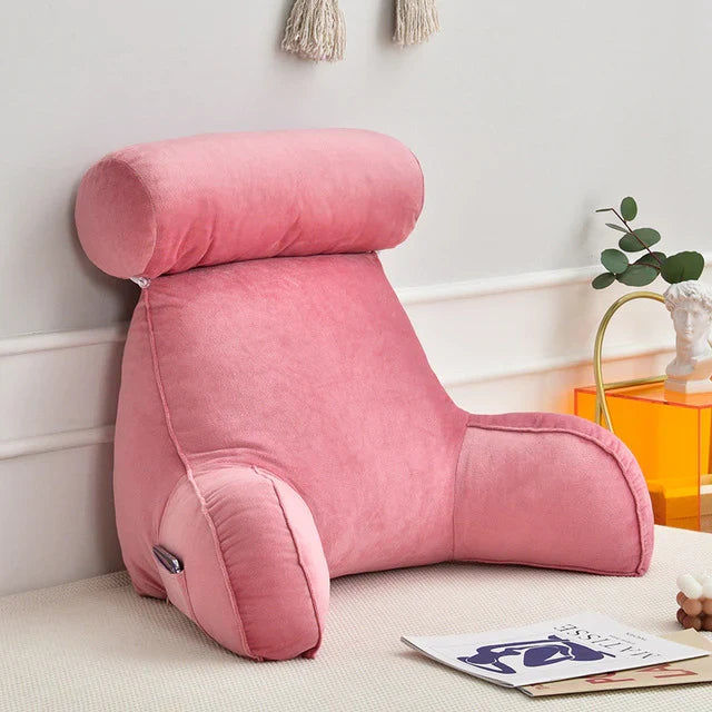 Memory foam reading bed pillow with integrated arm, back, and neck support for lounging.