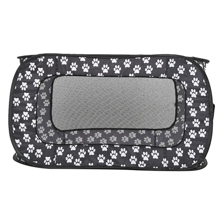 Collapsible fabric dog crate with fun paw patterns, ensuring a comfortable spot for your furry friend.
