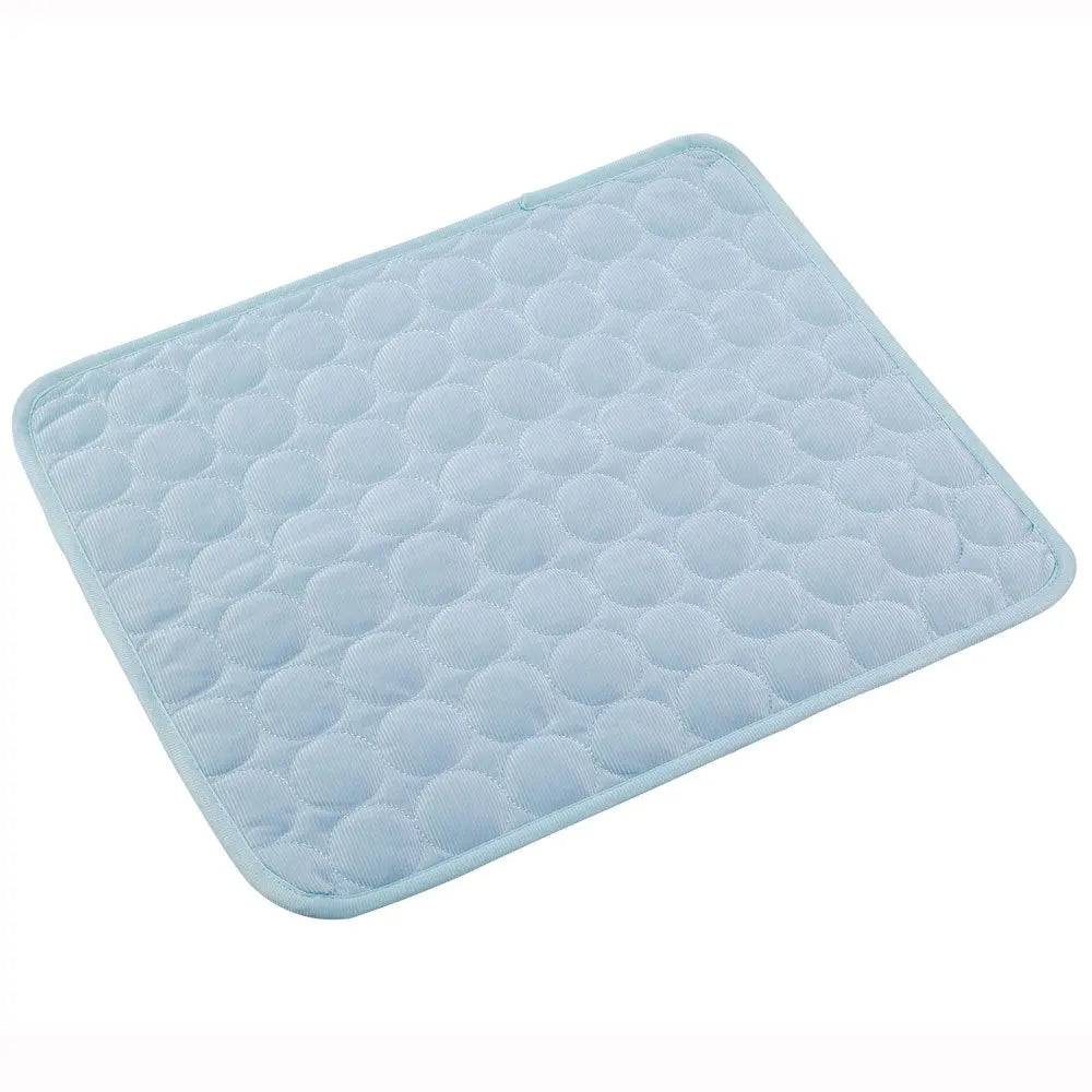 Portable pet bed and self-cooling mat, rolled up for easy travel, durable and ready for outdoor adventures.