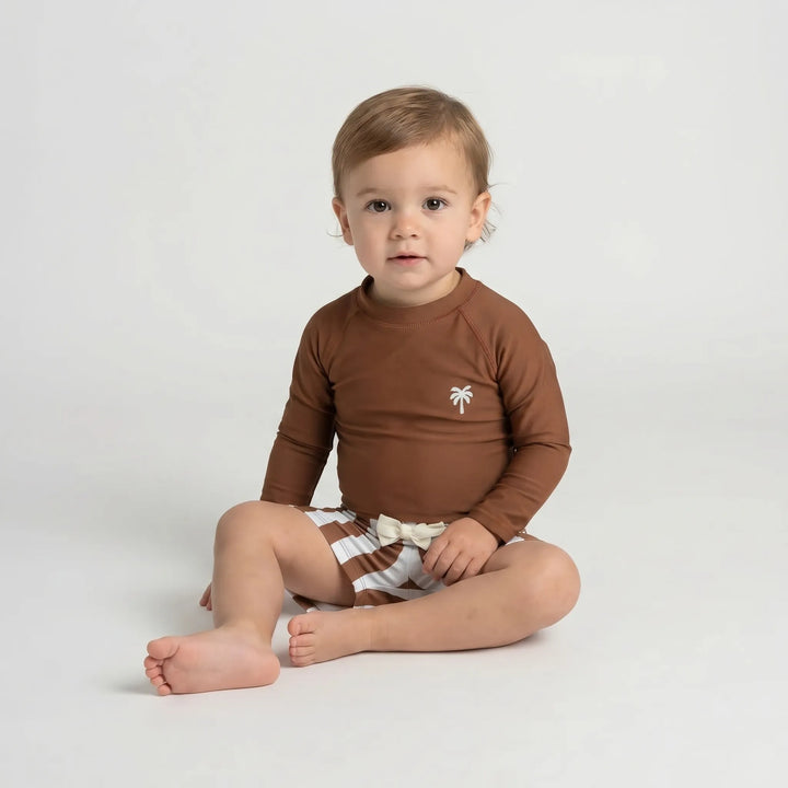Vibrant pattern on a unisex long sleeve toddler swimwear set, ensuring sun protection for baby's summer adventures.