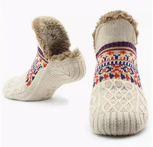 Unisex indoor slipper socks with grippers, offering plush comfort and warmth for relaxing at home.