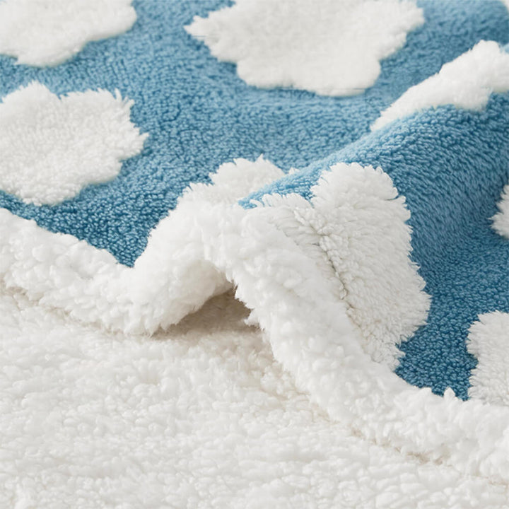 Folded waterproof pet blanket with sherpa fleece, ready for travel or as a cozy furniture protector.