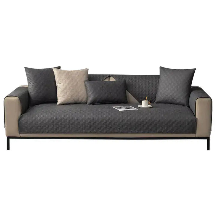 Neutral-toned sofa protector providing complete coverage for a couch, waterproof and non-slip
