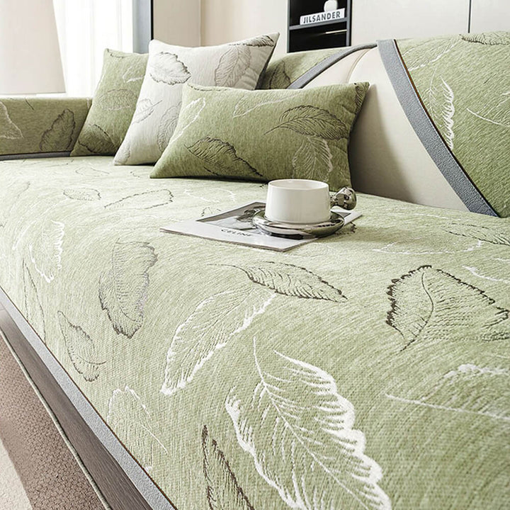 Chenille couch cover showcasing its non-slip feature and elegant leaf pattern, great for home decor.