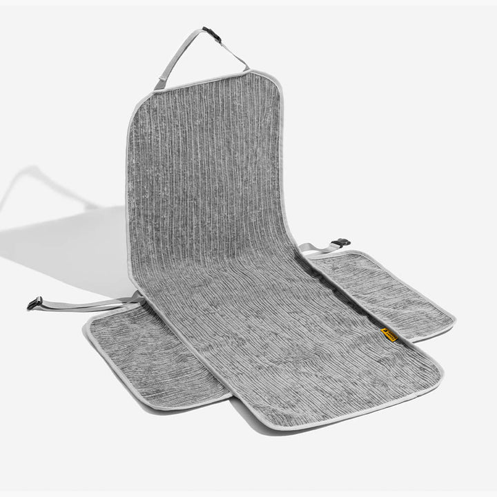 Pet car seat protector display, highlighting its features: waterproof, washable, and non-slip for dogs