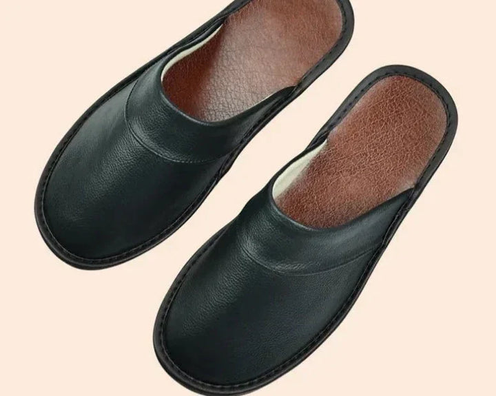 Men's black ultra-comfort slip-on house slippers for ultimate indoor relaxation.