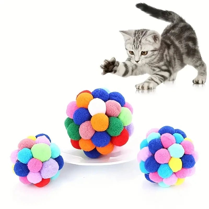 Close-up of fluffy, colorful cat balls, perfect pet supplies for enhancing interactive play sessions.