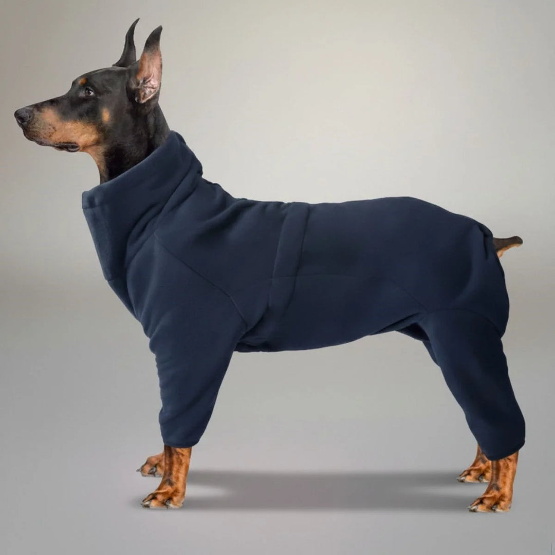 Cozy red fleece dog jumpsuit, full body pet apparel, designed for warmth during winter walks and outdoor play.