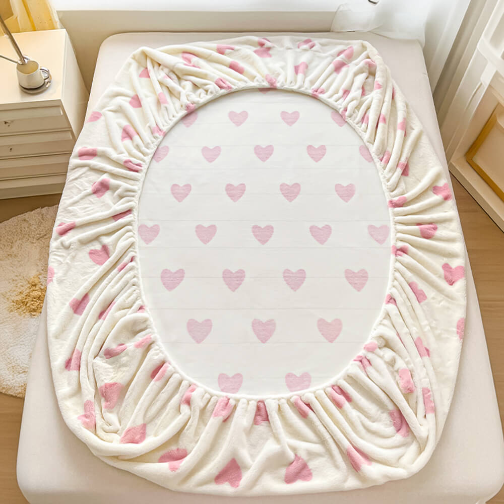 Soft milk velvet fitted sheet and matching pillowcases set, anti-static bedding for comfort.