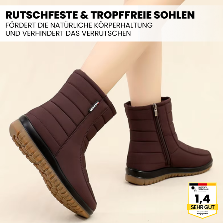 "Wasserdichte, braune Damenstiefel mit rutschfester Sohle für Herbst und Winter, isoliert gegen Kälte."