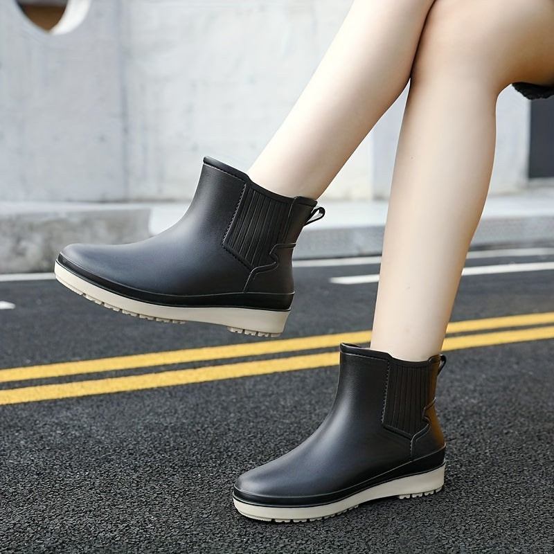 "Wasserdichte, stilvolle Regenstiefel mit rutschfester Sohle, ideal für Outdoor-Aktivitäten bei nassem Wetter."