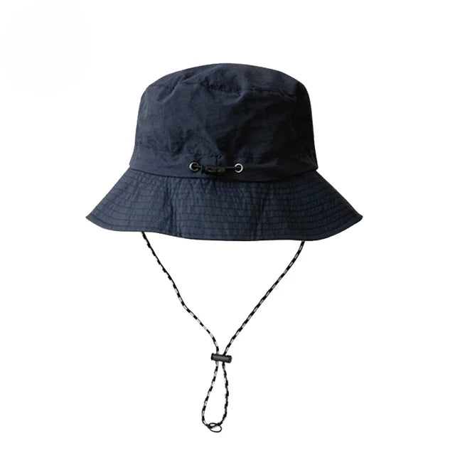 "Wasserdichter, faltbarer Bucket Hat, UPF 50+, breite Krempe, ideal für Outdoor-Aktivitäten, unifarbenes Design."