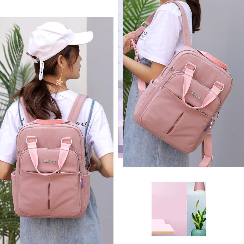 "Wasserfester Rucksack mit USB-Ladung, große Kapazität, schwarz, Vorderansicht; ideal für Reisen und Alltag."