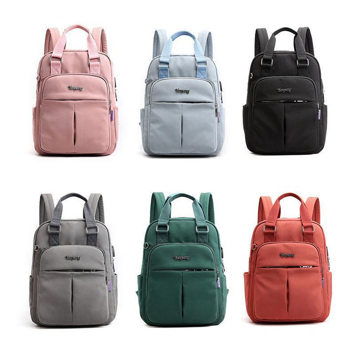 "Wasserfester Rucksack mit USB-Ladung, große Kapazität, schwarz, Vorderansicht; ideal für Reisen und Alltag."