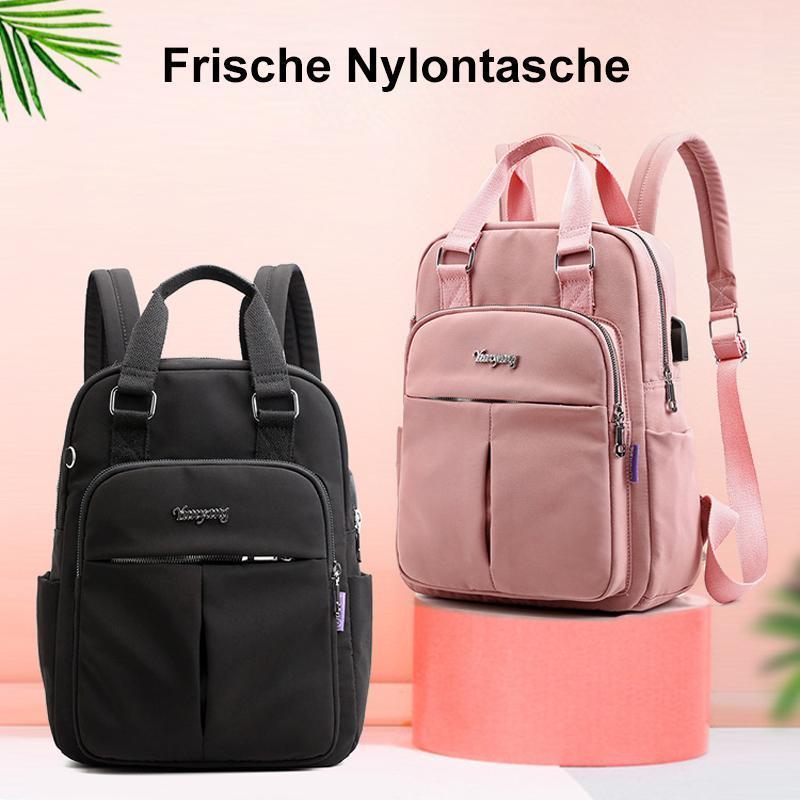 "Wasserfester Rucksack mit USB-Ladung, große Kapazität, schwarz, Vorderansicht; ideal für Reisen und Alltag."