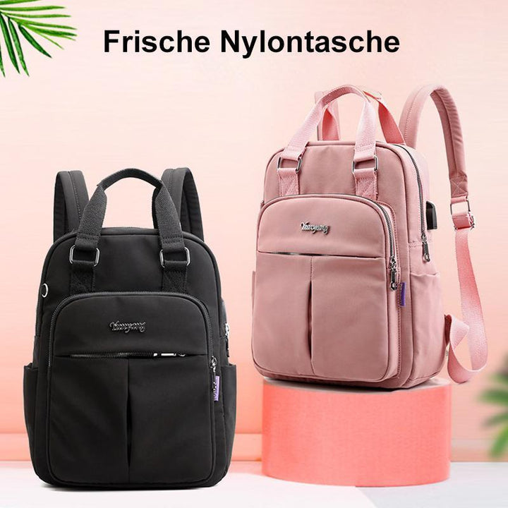 "Wasserfester Rucksack mit USB-Ladung, große Kapazität, schwarz, Vorderansicht; ideal für Reisen und Alltag."