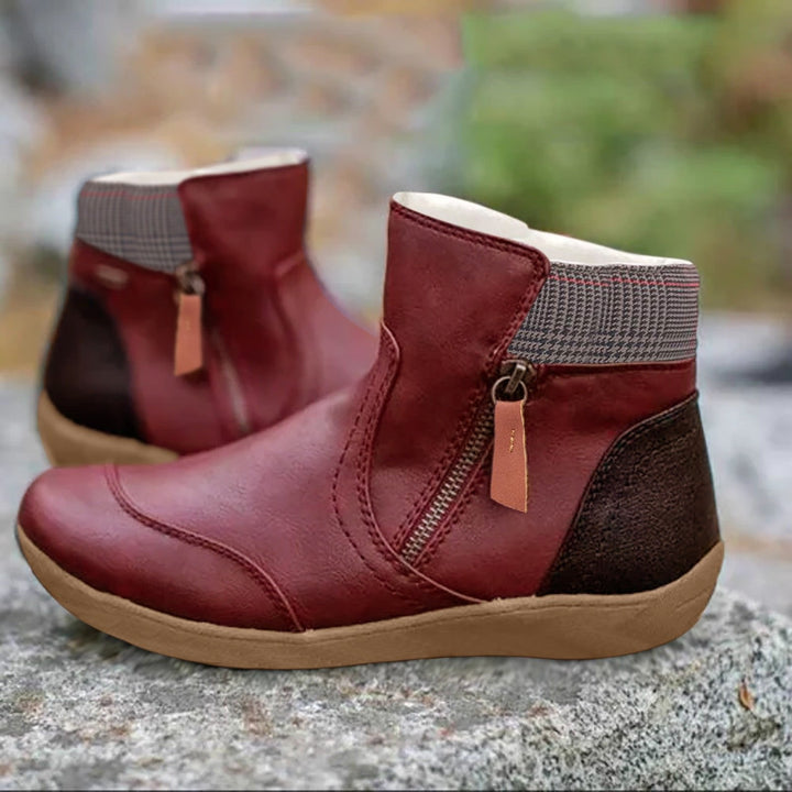 Durable women's all-weather ankle boots, featuring a sleek design, waterproof protection, and easy-access zipper.