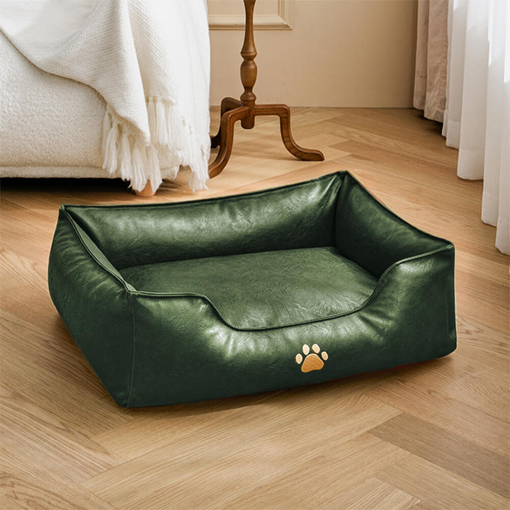 Waterproof faux leather dog bed displayed against a neutral background, highlighting its premium finish