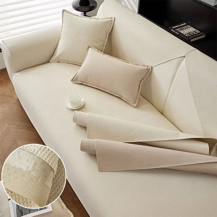 Dog comfortably resting on a durable waterproof sofa protector, showing its pet-friendly design.