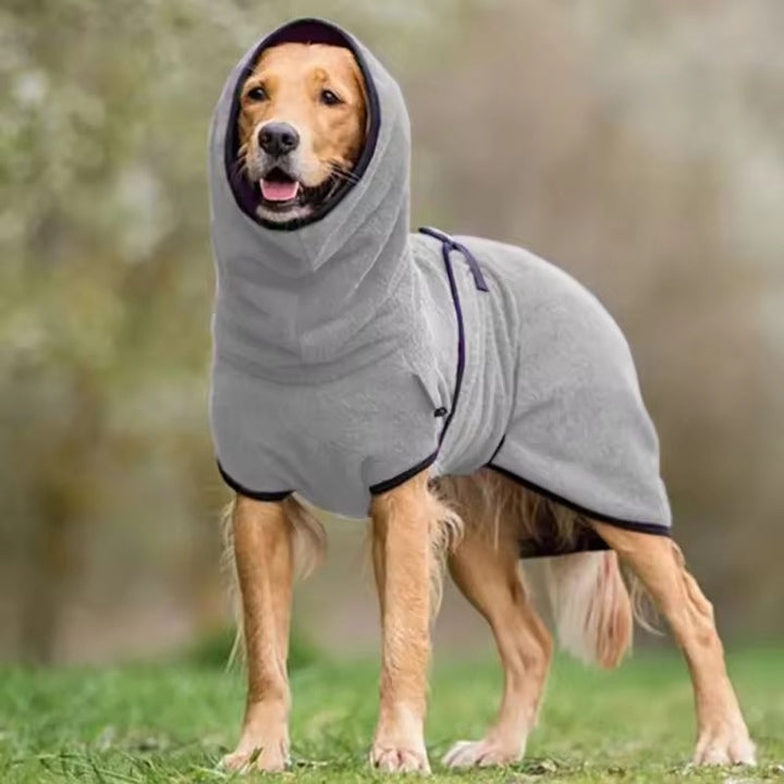 Golden Retriever wearing a waterproof reflective dog winter coat, playing outdoors. Pet jacket.