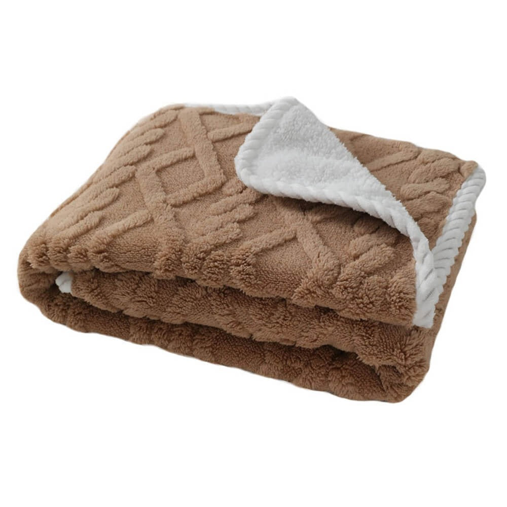 A dog comfortably napping on a waterproof soft fleece pet blanket, illustrating pet comfort and furniture protection