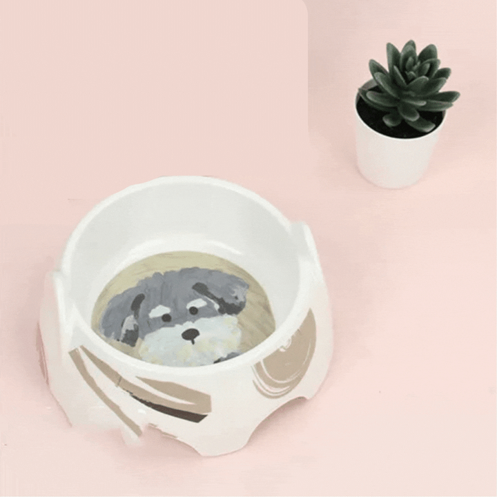 Easy-to-clean ceramic dog bowl with a cute dog design, essential for pet feeding and hydration. Long-lasting.