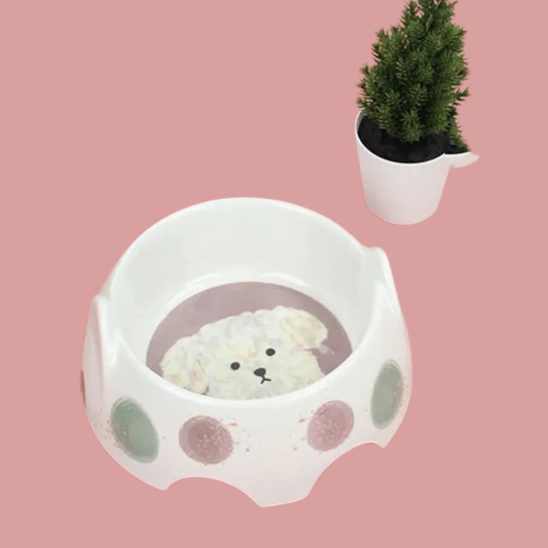 Ceramic pet feeder bowl with playful dog art, perfect for dogs' food and water. A sturdy and cute option.