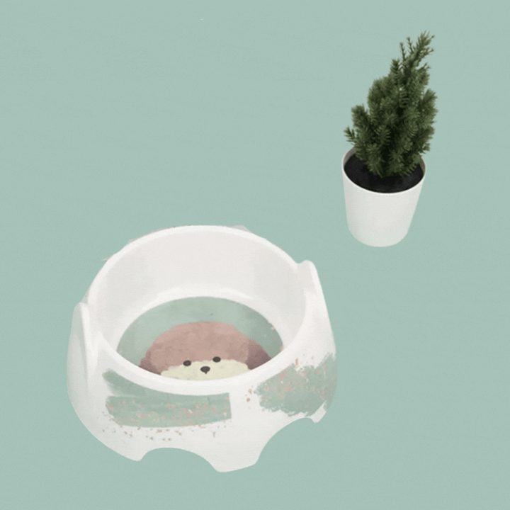 Heavy-duty ceramic dog bowl featuring a whimsical dog design, great for pet food or water. Non-slip base.