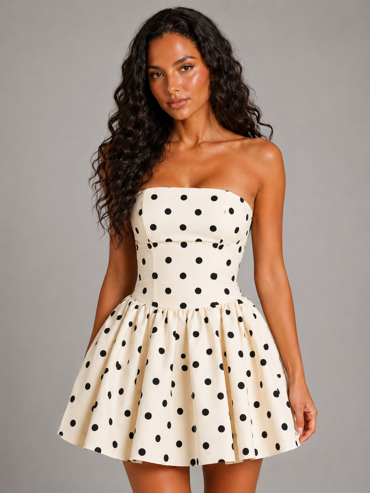 Flirty women's white strapless polka dot skater mini dress with corset detail, ideal for homecoming or party nights.
