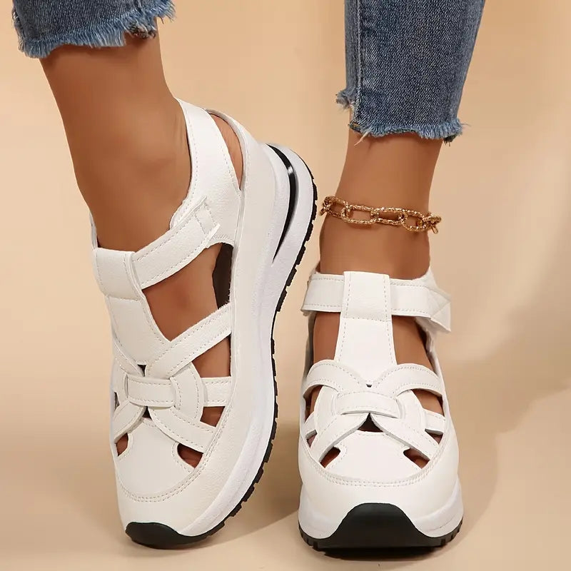 Modern white women's cut-out flatform sandals with secure velcro ankle strap, ideal for casual summer.