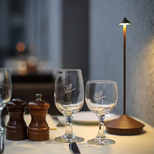 Sleek LED table lamp with dimmable light, wireless design. Ideal for contemporary home decor, indoor use.