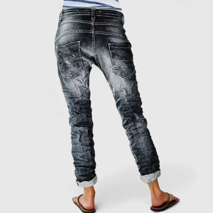 Women's acid wash skinny jeans with striking contrast stitch details, perfect for a vintage casual look.